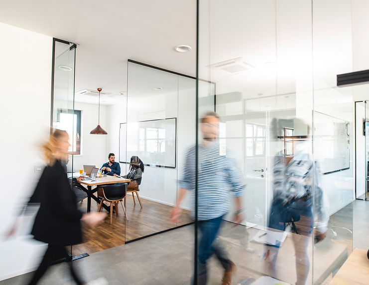 People moving through a modern office